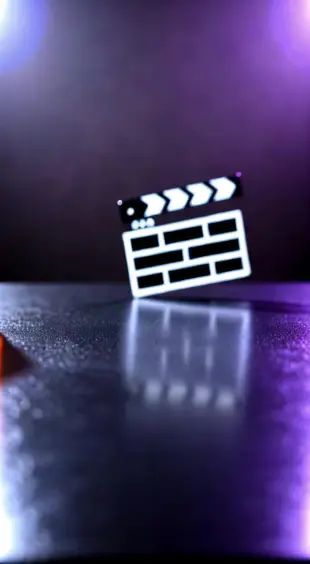 AI Video: Create a moving animation of 
a film logo Make one m have long lashes and...