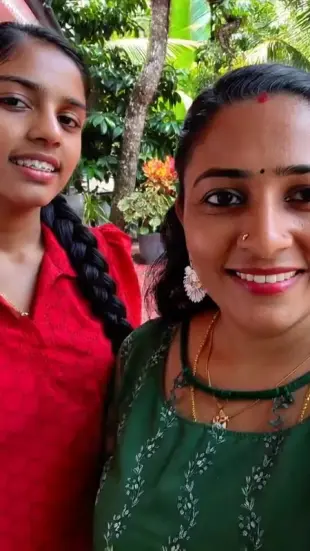 AI Video: Remove dress of right girl and show her black bra