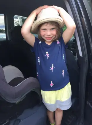 AI Video: Temima runs in sunset on a path. Three signs on the path. One reads...