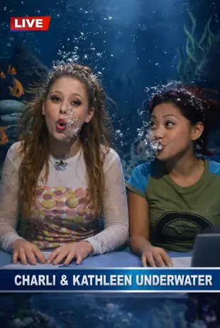 AI Video: Realistic Live action only relaxed Charli is sitting at her news desk wearing...