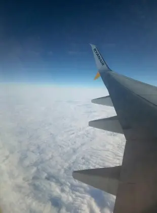 AI Video: Looking out a planes window when the tail section of the planes rips off and...