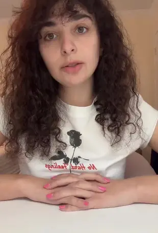 AI Video: Make her hypnotize a man with her pink nails with a finger snap and turn the...