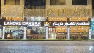 AI Video: Use the provided image of Lahore Darbar Restaurant to generate a realistic...