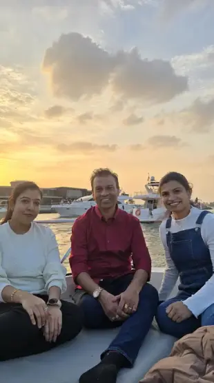 AI Video: Make a video of above women kissing the man passionately.