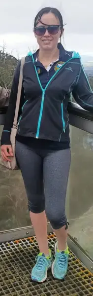 AI Video: change her clothing to a pair of pantyhose and a red one piece swimsuit,