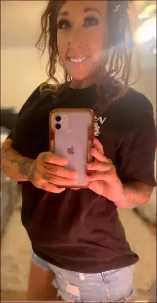 AI Video: She takes her shirt off over her head revealing her bare breasts, then pulls...