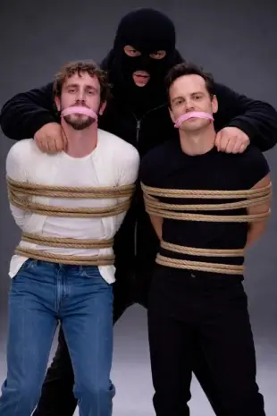 AI Video: Balaclava man menaces the other two men.