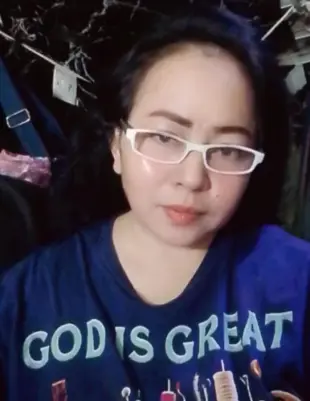 AI Video: A lady Cooking vegetables outside the bamboo house using pot and firewood...