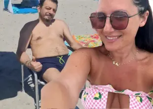 AI Video: She sensually undresses and shows her naked breasts and her naked pussy, she...