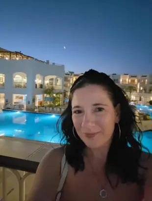 AI Video: make the girl smoke a cigarette taking a deep cheek hollowing drag  like she...