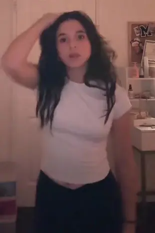 AI Video: Make high quality video, of someone squeezing her breasts, and her...