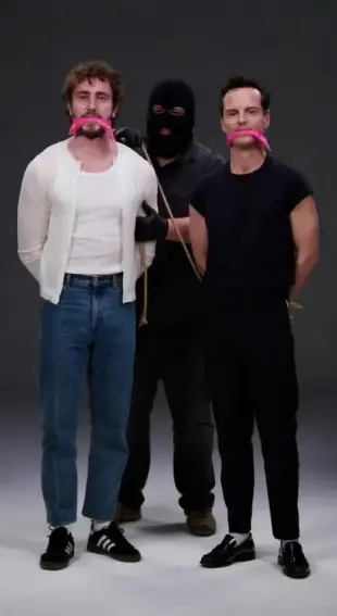 AI Video: Balaclava man roughs up the tied men.