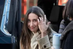 AI Video: have her swiping her hair back and smiling and saying hey keep her arm and...