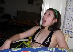 AI Video: Person looks at me opens his mouth stick out showing his tongue and stays...