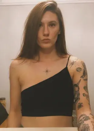 AI Video: Show her slowly sucking on a popsicle