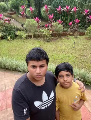 AI Video: Create a video showing Neil ( boy in black Tshirt) celebrating his birthday...