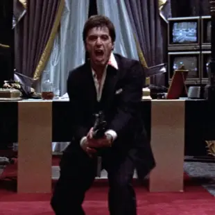 AI Video: Tony Montana from the movie Scarface shouts "say hello to my little friend!"...