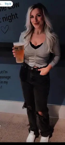 AI Video: She pours the drink down her blouse and reacrs in shock but then laughs