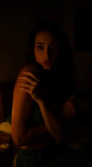 AI Video: She gasps sharply, chest heaving, then suddenly freezes. Her shoulders drop...