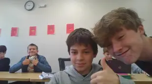 AI Video: make the boy in the grey stand up and do a back flip and say I live fishing...