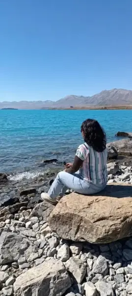 AI Video: Create a video of me walking to the stone and siting down on it and then...