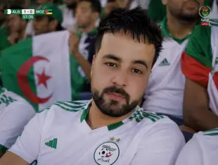 AI Video: Ultra realistic live football broadcast shot, Algerian football fan in...