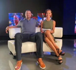 AI Video: she stands up and then she sit on his knee and they kiss