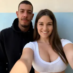 AI Video: The woman kisses the man and smiles to the camera. After that she puts her...