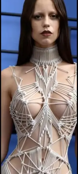 AI Video: Jenna ortega keeps walking as she is modeling but is now bouncing her body