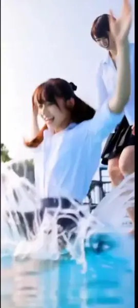 AI Video: The Japanese girl falls fully into pool, wet, she turns and facing her...