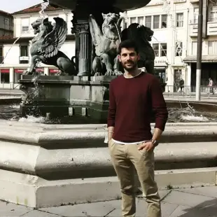 AI Video: the man slowly starts walking towards the camera. at the end he smiles and...