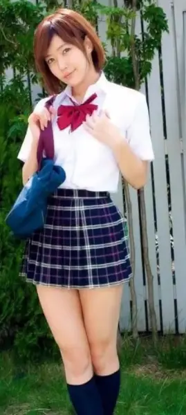 AI Video: Japanese schoolgirl in garden walks towards you pretending to be a model