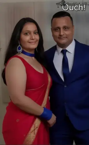 AI Video: the man sits on a couch. and the lady walks to the kitchen in hot way