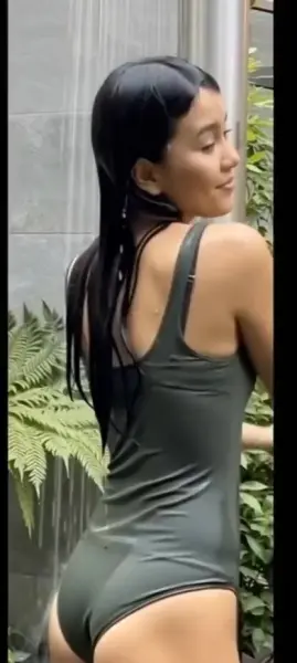 AI Video: Zendaya cheekily pulls her straps down off shoulders