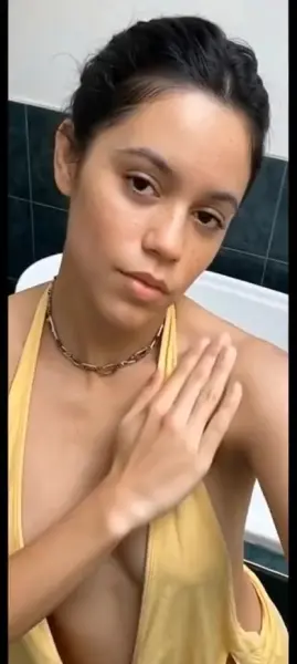 AI Video: Jenna ortega notices her bikini straps are getting in the way, so slides them...