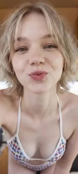 AI Video: Emma myers looks super cute and sexy blowing you a kiss in her skimpy bikini