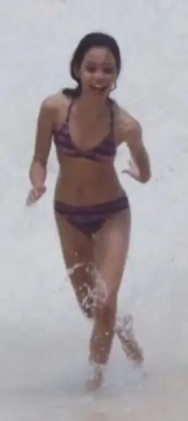 AI Video: Jenna Ortega Splashing about in ocean as teenager